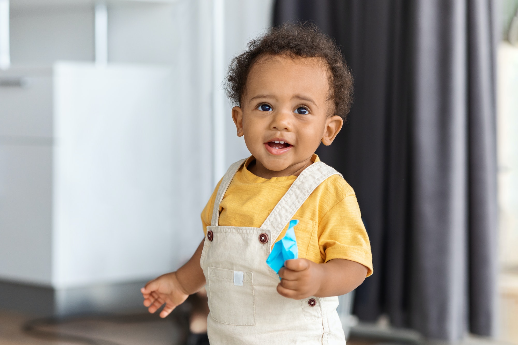 Portrait Of Cute Adorable Black Baby Boy With Curly Hair